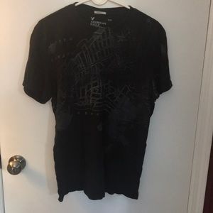 Black T with design.